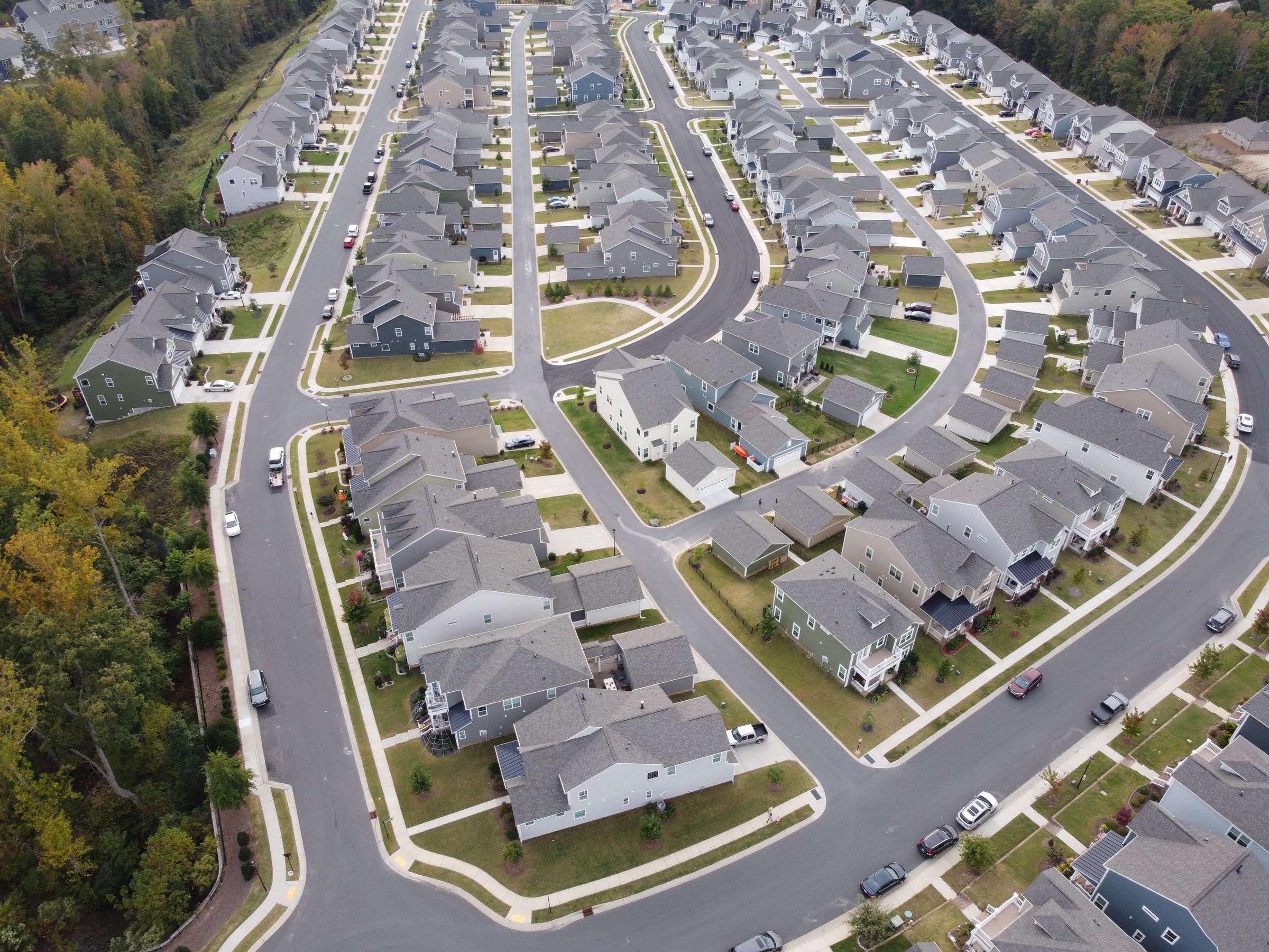 Aerial view of a subdivision of shingle roofs
